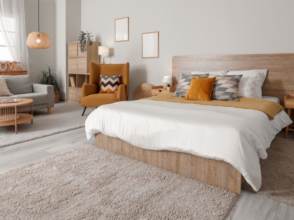 Stylish,Interior,Of,Bedroom,With,Comfortable,Armchair,,Sofa,And,Bed